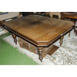 A late Victorian oak dining table with 1 extra leaf.