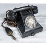 A vintage black bakelite bell telephone