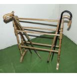 A towel rail and four walking sticks