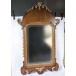 A reproduction wall mirror