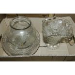 A glass vase, gold fish bowl and other items