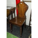 A Victorian mahogany hall chair.