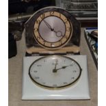 A retro wall clock and a mantle clock