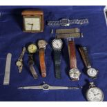 A collection of wrist watches, travel clock and pocket watch