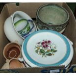 A box of pottery items