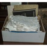 A box containing vintage linen