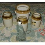 Four stoneware jars and a lamp