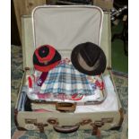 A vintage suitcase containing vintage clothing