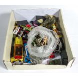 A box containing model die cast cars and other toys