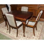 A draw leaf table and 4 chairs.