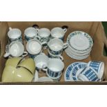 Box containing Midwinter teacups and saucers