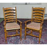 A pair of ladder back chairs.