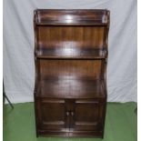 A 20th century mahogany waterfall bookcase.