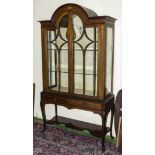 An Edwardian inlaid mahogany display cabinet with double doors and dome top.