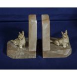 A pair of onyx bookends with cold cast bronze terrier dogs