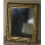 A gilt framed wall mirror 74cm x 61cm