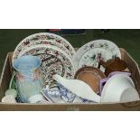 A box containing assorted pottery items