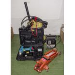 A Drill, battery charger, car jack.