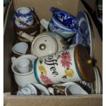 A box containing assorted pottery items