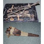 A box containing vintage tools and saws