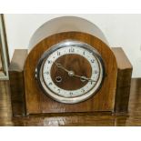 A 1930s walnut mantle clock.