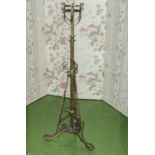 An Edwardian brass standing lamp.