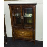 An Edwardian inlaid rosewood cabinet.