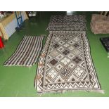 Four rugs/wall hangings