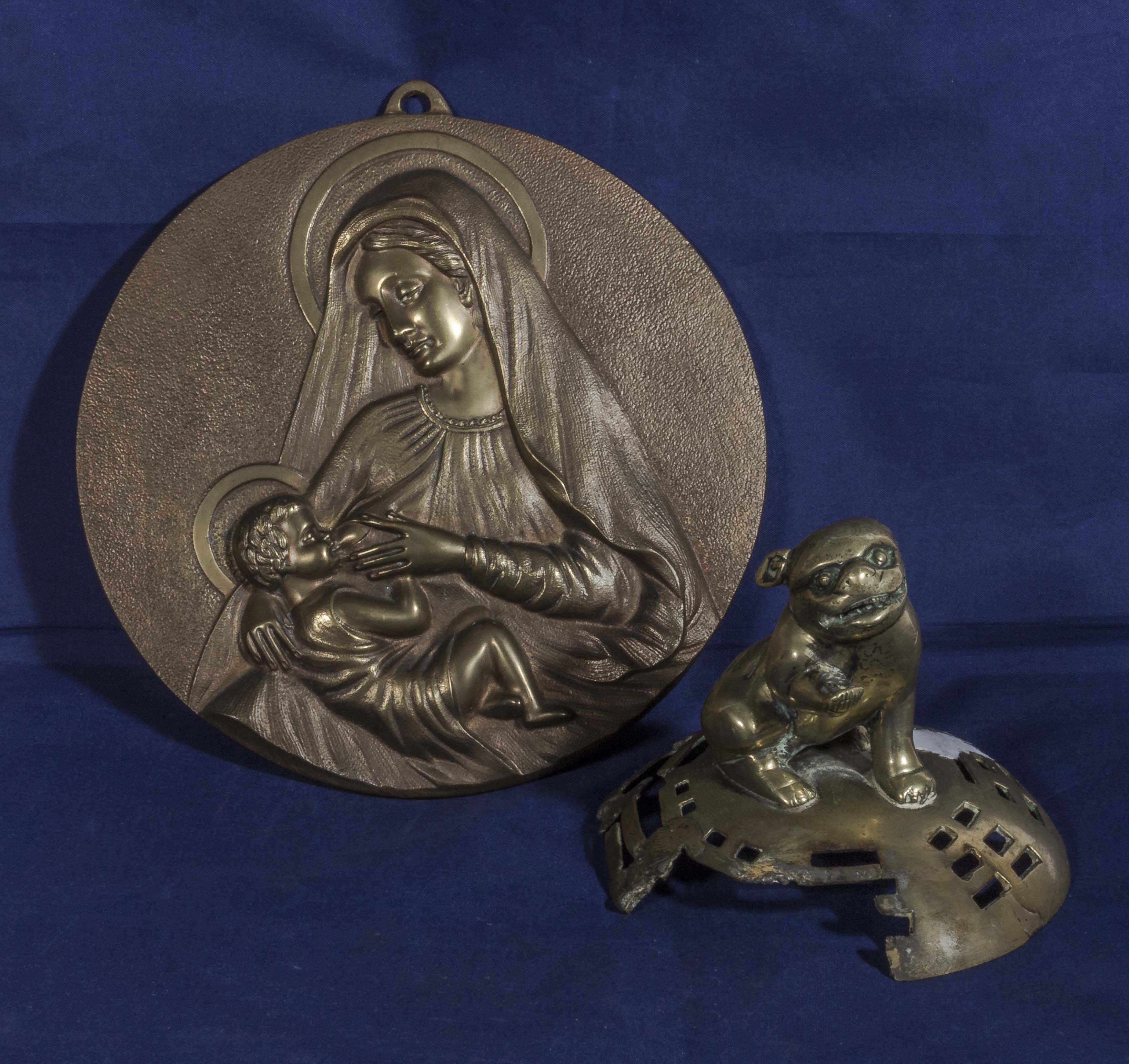 A bronze roundel plaque of Madonna and child signed B Menzwiecki.(Polish)