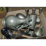 A box containing pewter items