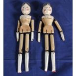 A pair of peg dolls.