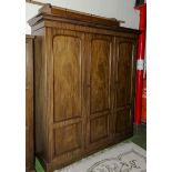 A Victorian mahogany 3 door robe with fitted slide out shelves.