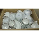 A box containing assorted china