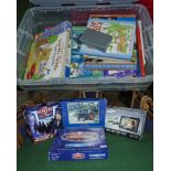 A box containing assorted childrens books and games