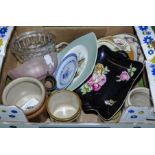 A box containing assorted pottery items