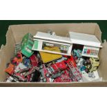 A box containing diecast cars and other items