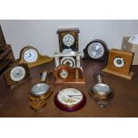 Eight mantle clocks and two barometers