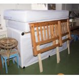 Two single divan beds with drawers and pine headboards