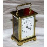 A small brass carriage clock