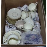 A box containing assorted tea ware