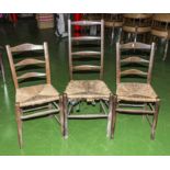 Three rush seated kitchen chairs