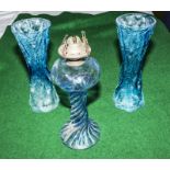 Two blue art glass vases and an oil lamp