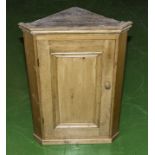 A small pine corner cabinet