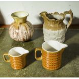 A vase, stoneware jug and two Hornsea jugs
