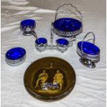 Five pieces of blue glass table wear and a decorative plate