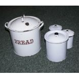 An enamel bread bin and three other enamel storage bins