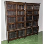 A pair of oak bookcases with leaded glass panels.