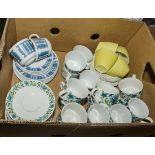 A box containing assorted tea ware