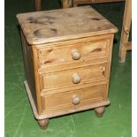 A pine bedside cabinet