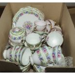 A box containing china tea ware